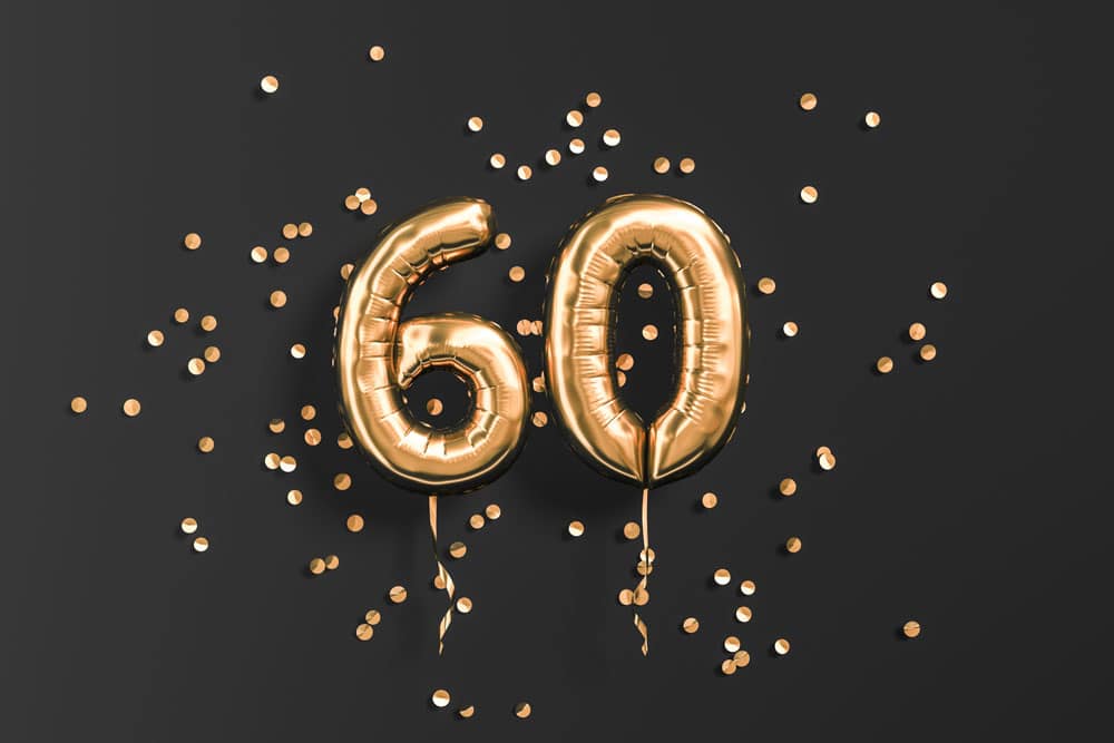 Number 60 in gold balloons